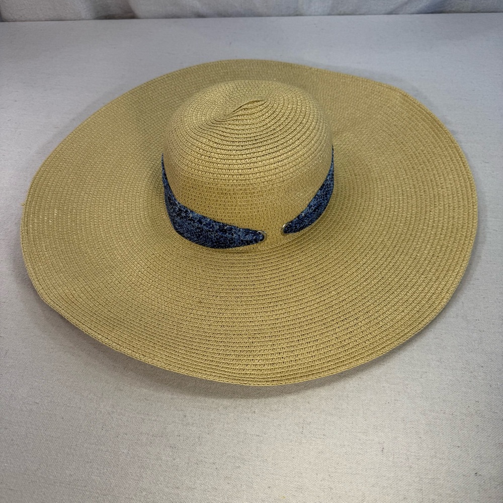 Calvin Klein wide-brimmed straw sun hat with a patterned blue band